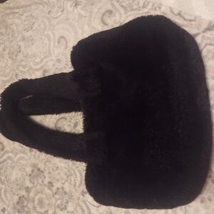 Black Furry Lolita Jade hand bag with zippered closure and black satin inside.